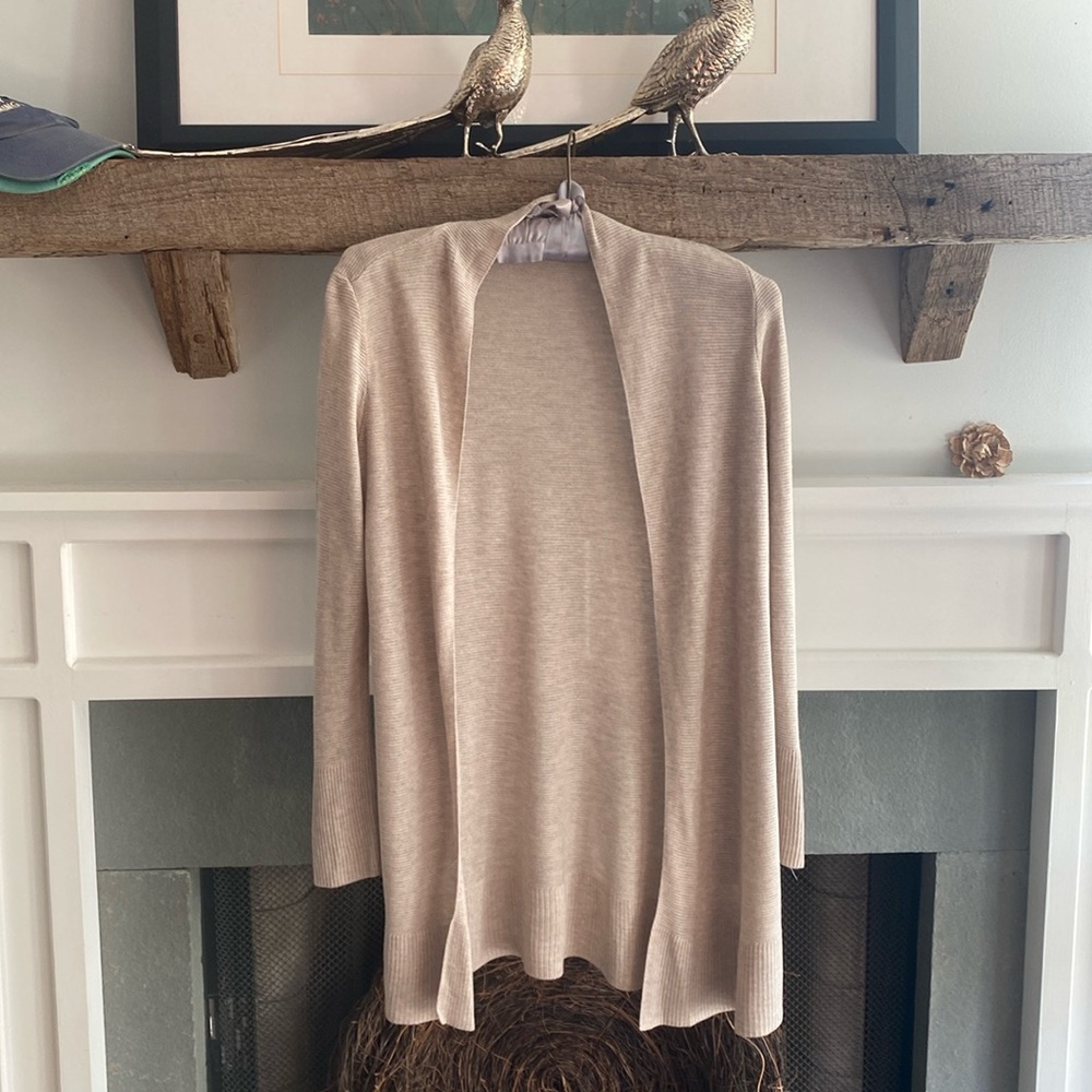 Lightweight beige colored cardigan.  100% Viscose.